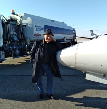 Re-fuelling at Regina airport: I am leaning on the nose of the aircraft